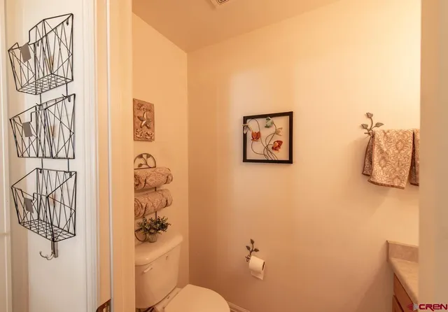 a bedroom with a bed a table and chairs