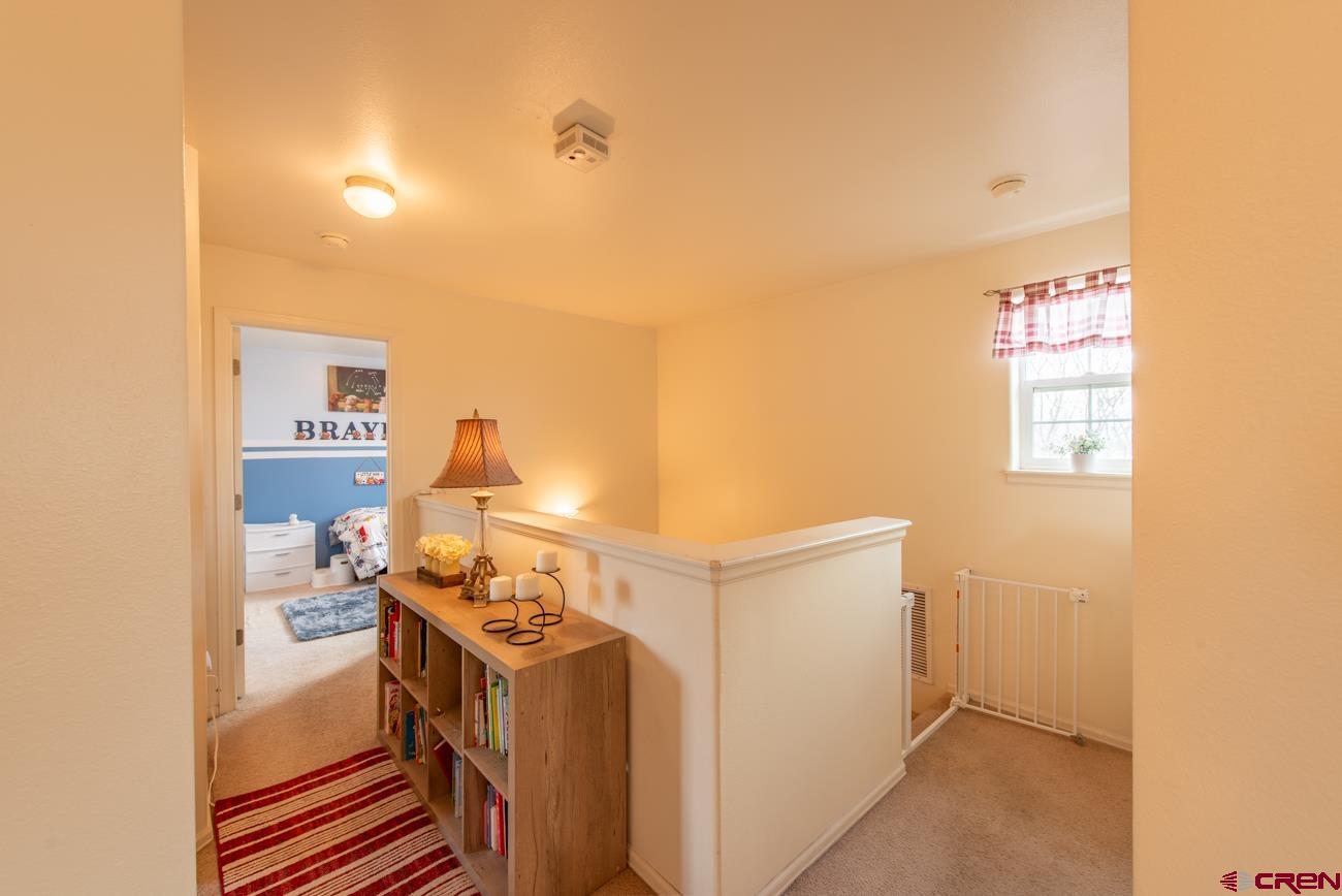 111 6675th Road Montrose, CO 81401 - Photo 26 of 40 a view of storage and utility room with washer and dryer