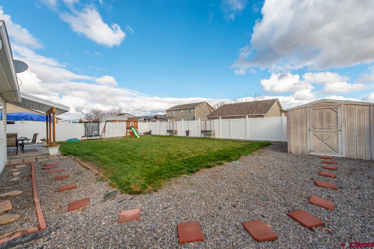 111 6675th Road Montrose, CO 81401 - Photo 34 of 40 a view of a street with a house in the background