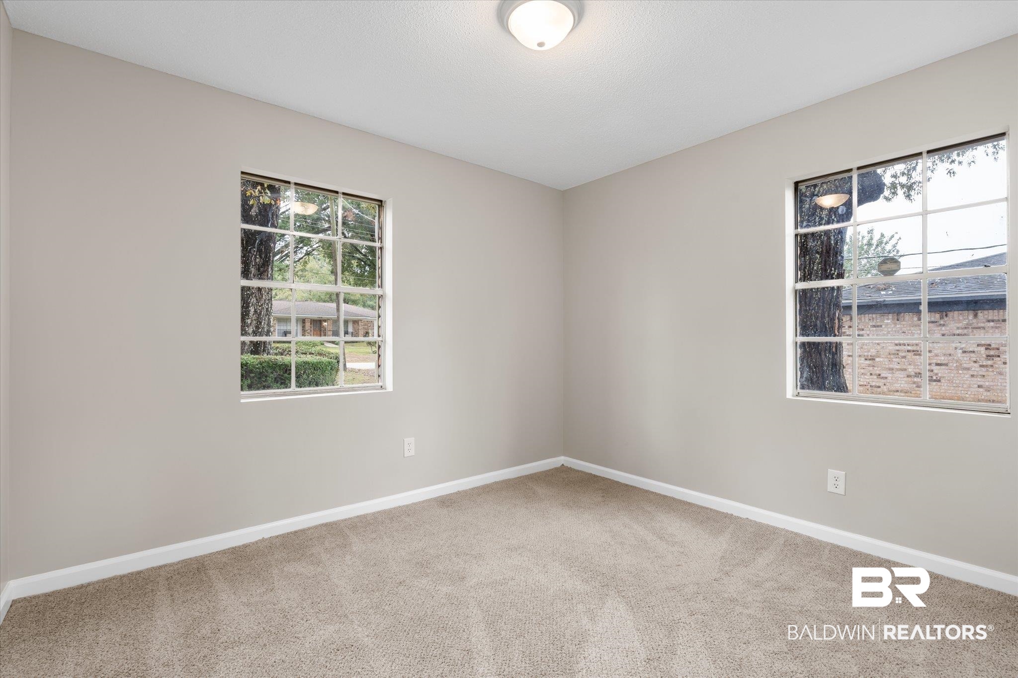 5015 Golfway Drive Eight Mile, AL 36613 - Photo 16 of 31 Spare room featuring carpet flooring and plenty of natural light
