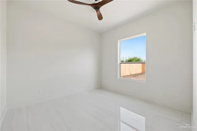 a view of an empty room and window