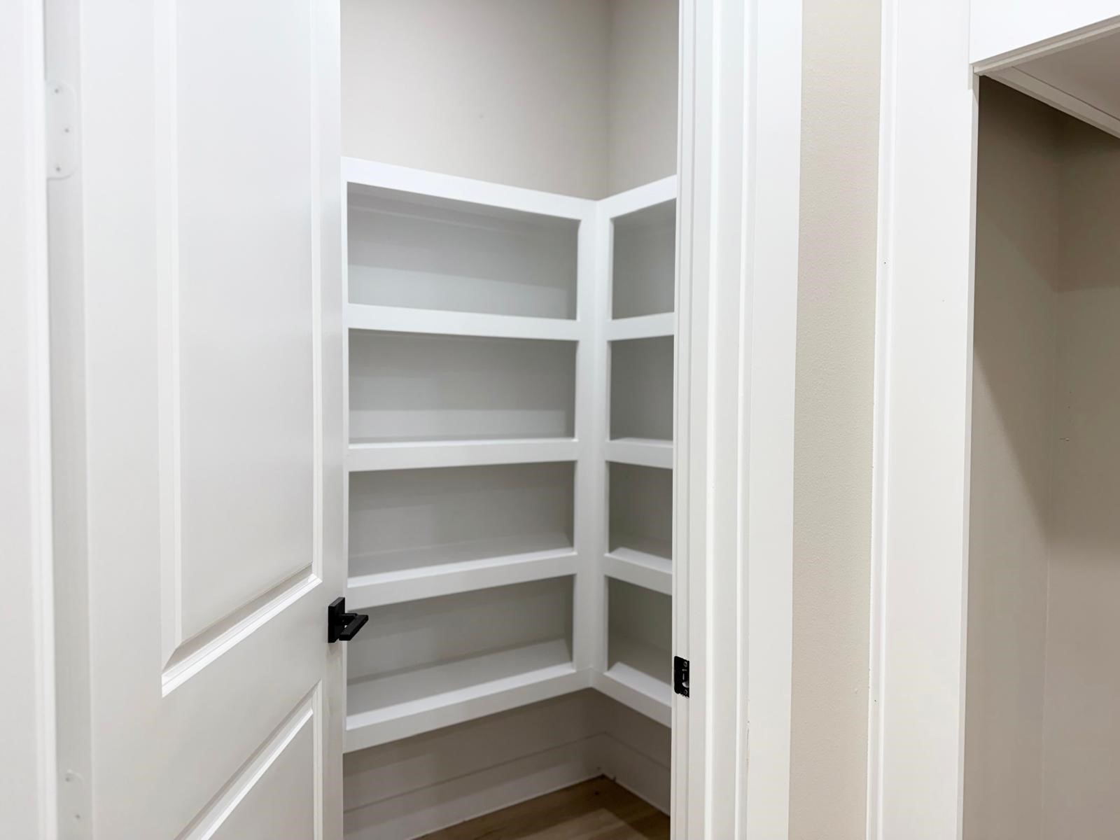 2518 Liguria Ln Spring Spring, TX 77388 - Photo 11 of 36 Spacious walk-in pantry with ample shelving for organized storage.