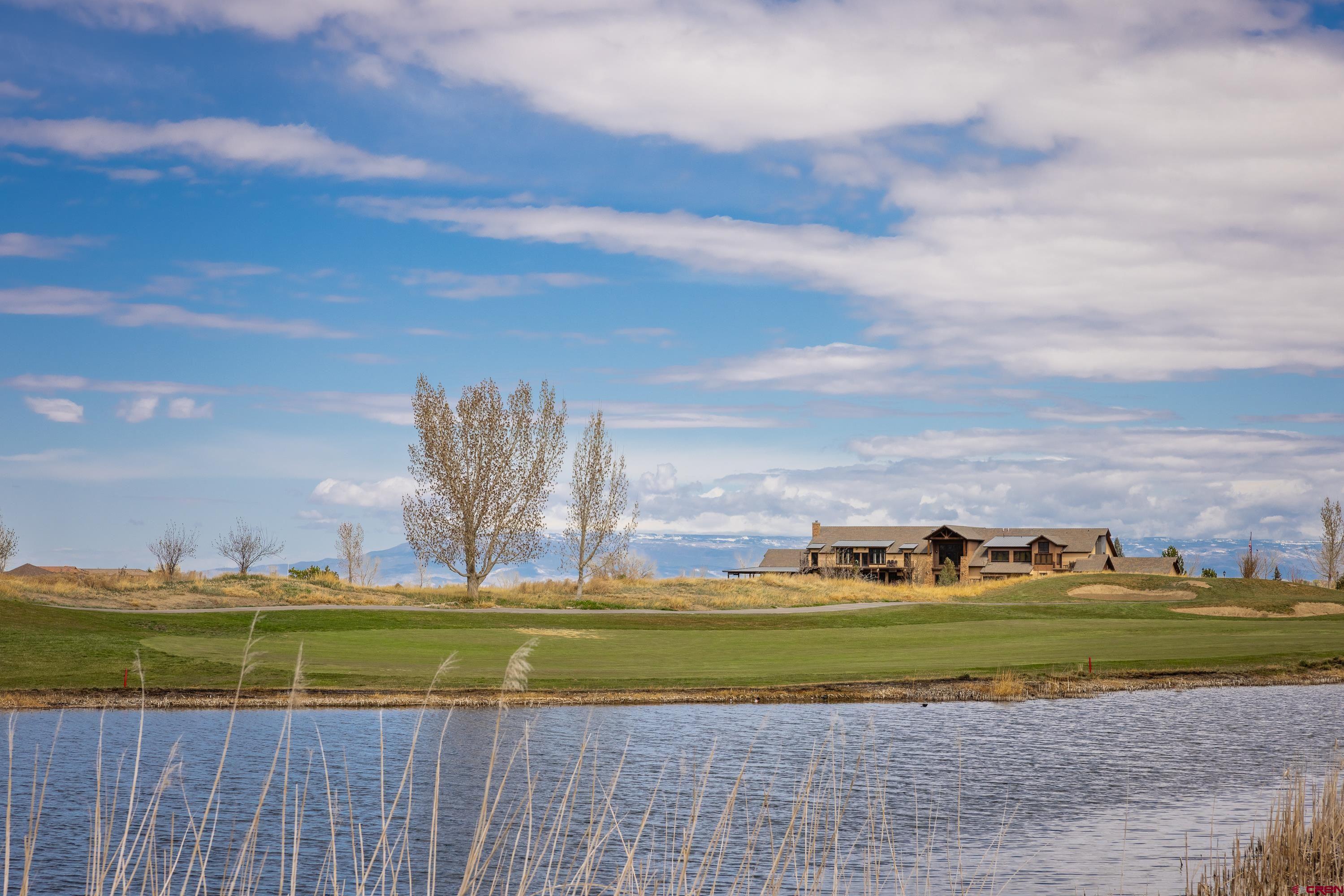 Lot 1928 Sleeping Bear Road Montrose, CO 81401 - Photo 11 of 12 a view of a golf course with on deck park