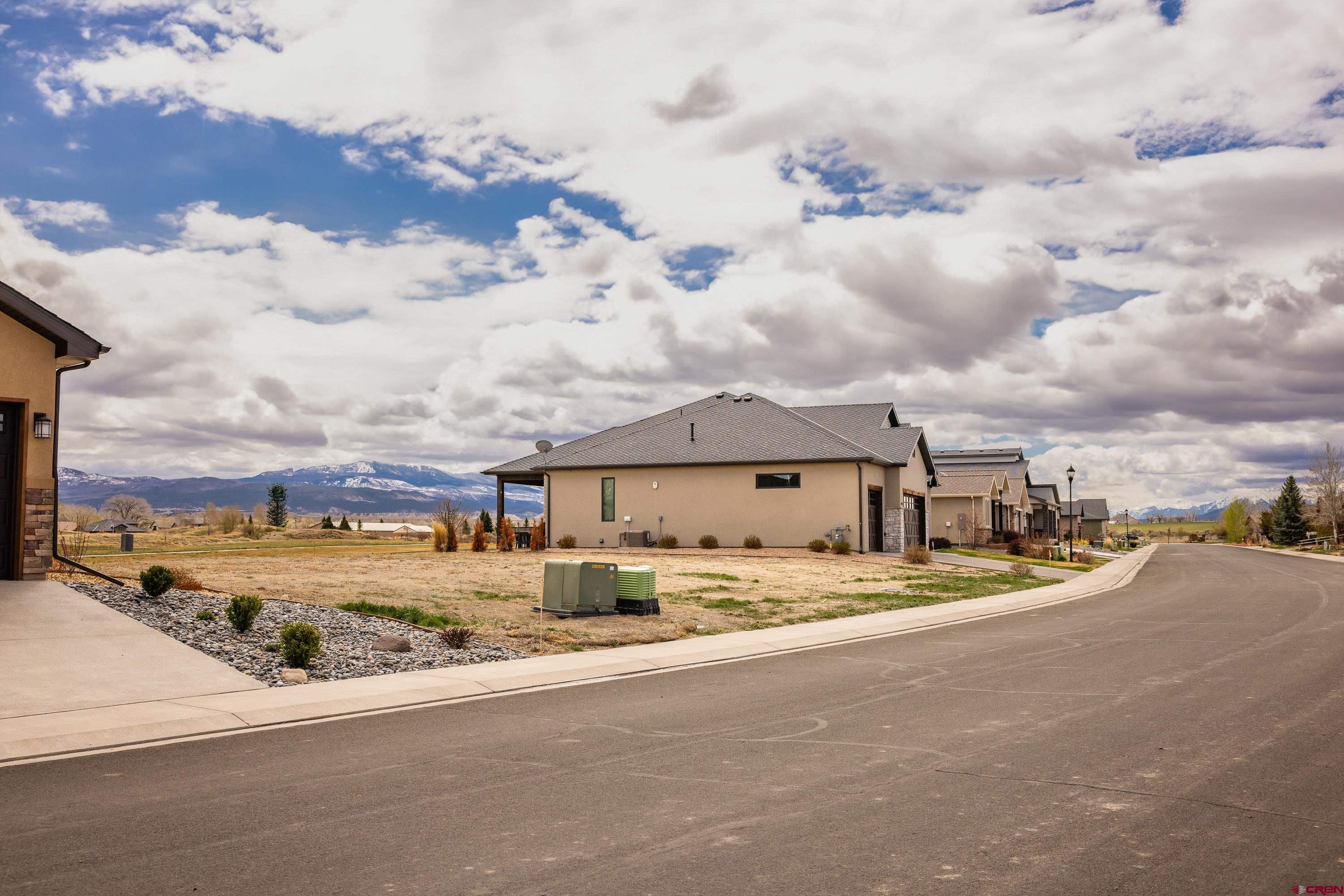Lot 1928 Sleeping Bear Road Montrose, CO 81401 - Photo 7 of 12 front view of a house with a big yard