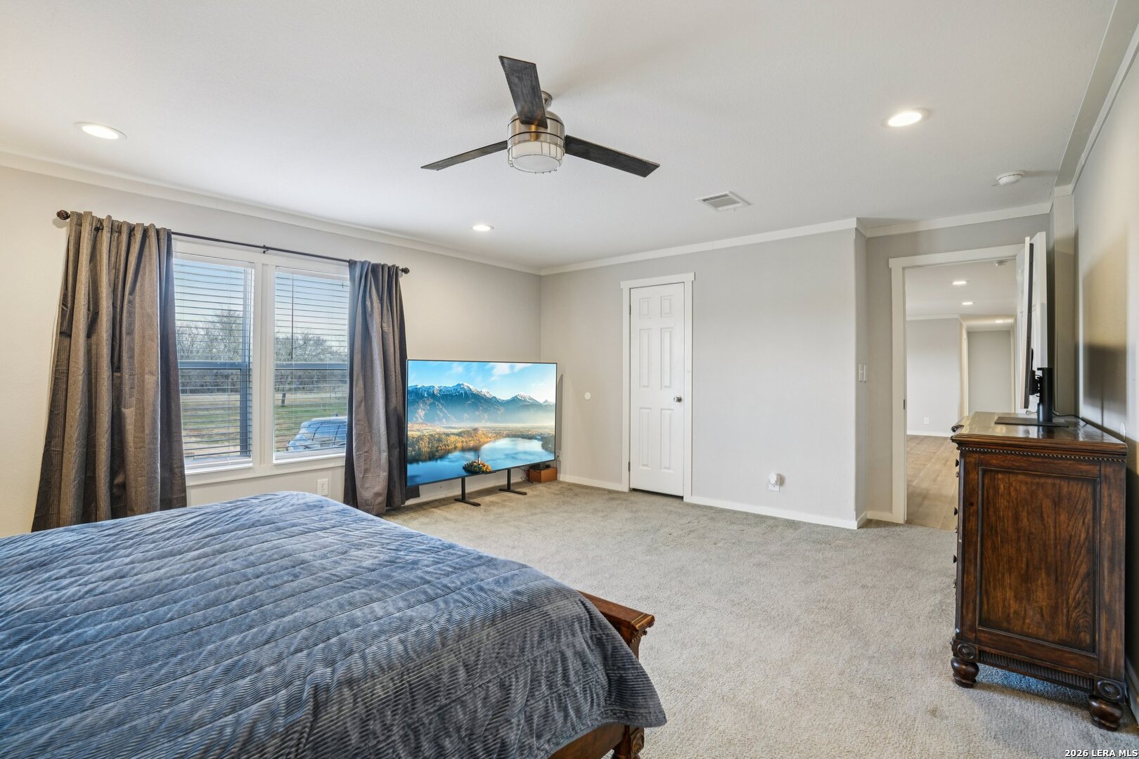 4045 Jakes Colony Road Seguin, TX 78155 - Photo 16 of 36 a bed room with a bed and a television