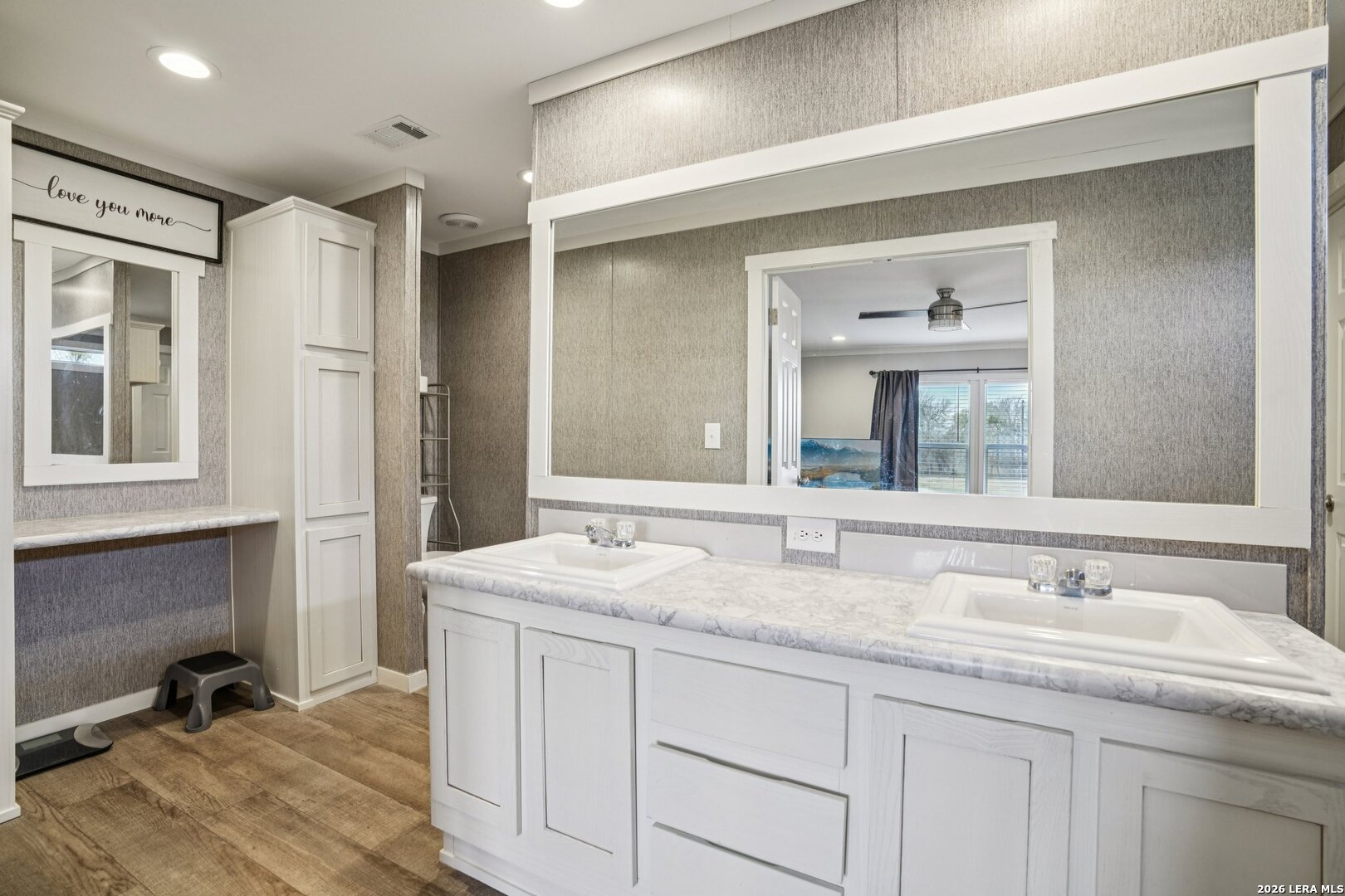 4045 Jakes Colony Road Seguin, TX 78155 - Photo 17 of 36 a bathroom with a granite countertop sink mirror and double