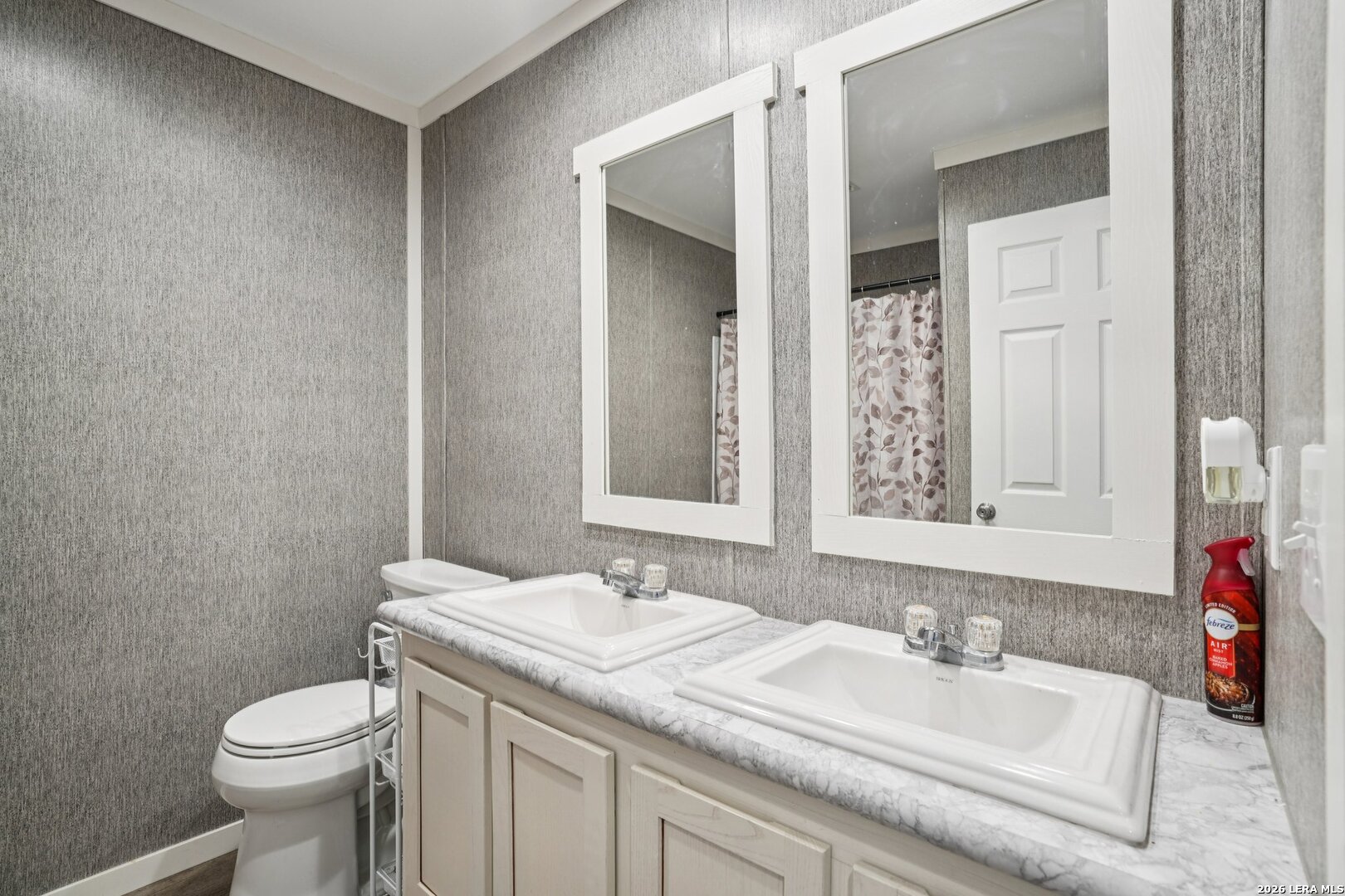 4045 Jakes Colony Road Seguin, TX 78155 - Photo 23 of 36 a bathroom with a granite countertop sink toilet and mirror
