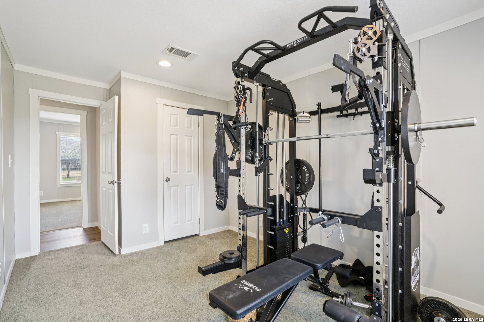 4045 Jakes Colony Road Seguin, TX 78155 - Photo 28 of 36 a view of a room with gym equipment
