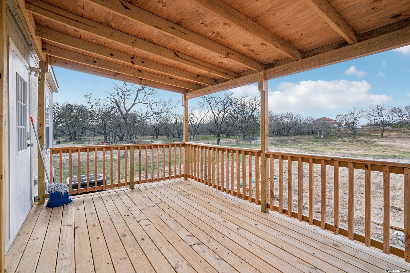 4045 Jakes Colony Road Seguin, TX 78155 - Photo 33 of 36 a view of deck with wooden floor and outdoor seating
