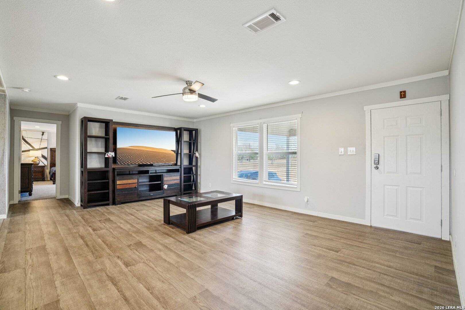 4045 Jakes Colony Road Seguin, TX 78155 - Photo 4 of 36 a view of a livingroom with furniture a ceiling fan and window