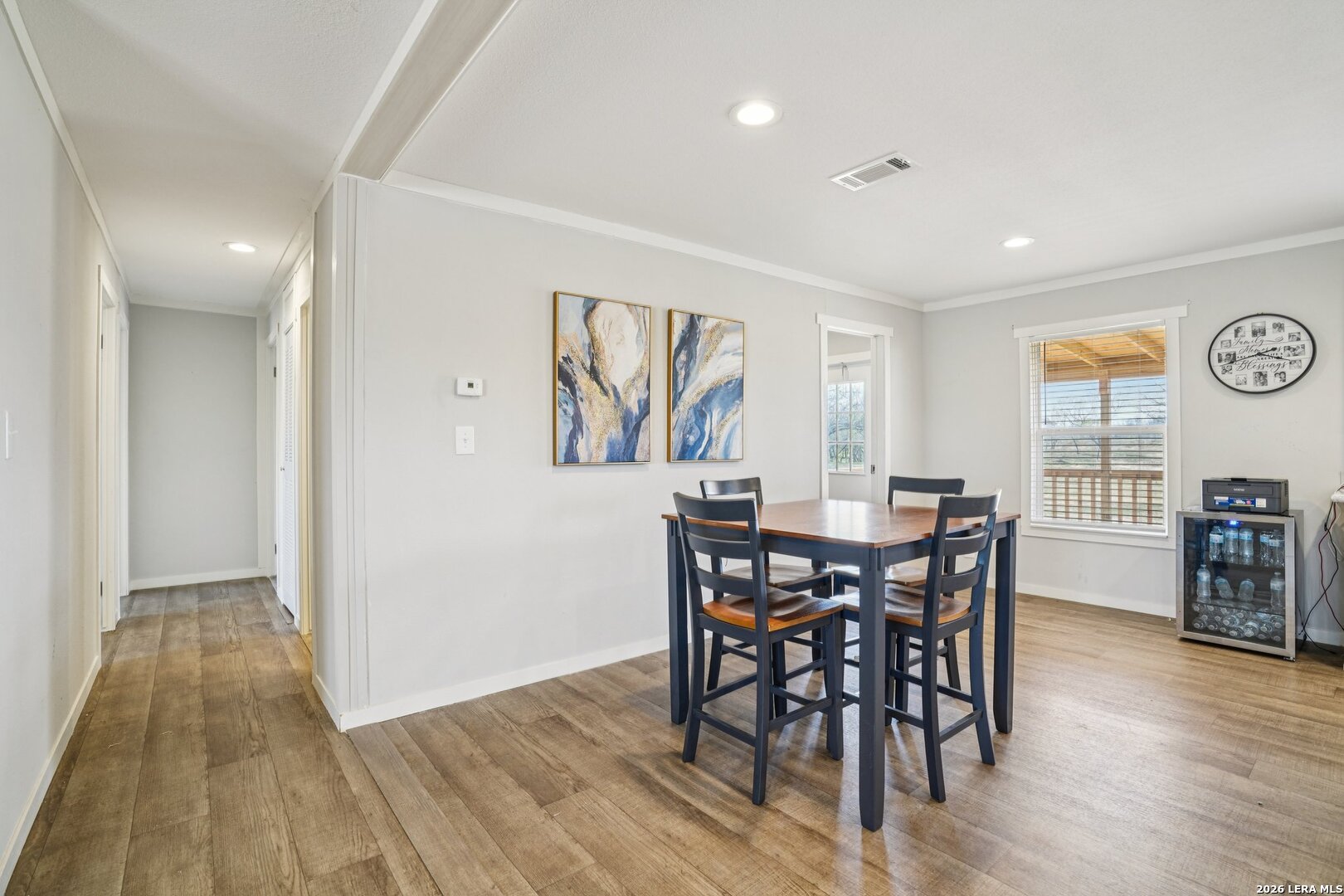 4045 Jakes Colony Road Seguin, TX 78155 - Photo 7 of 36 a view of a a dining room with furniture window and wooden floor