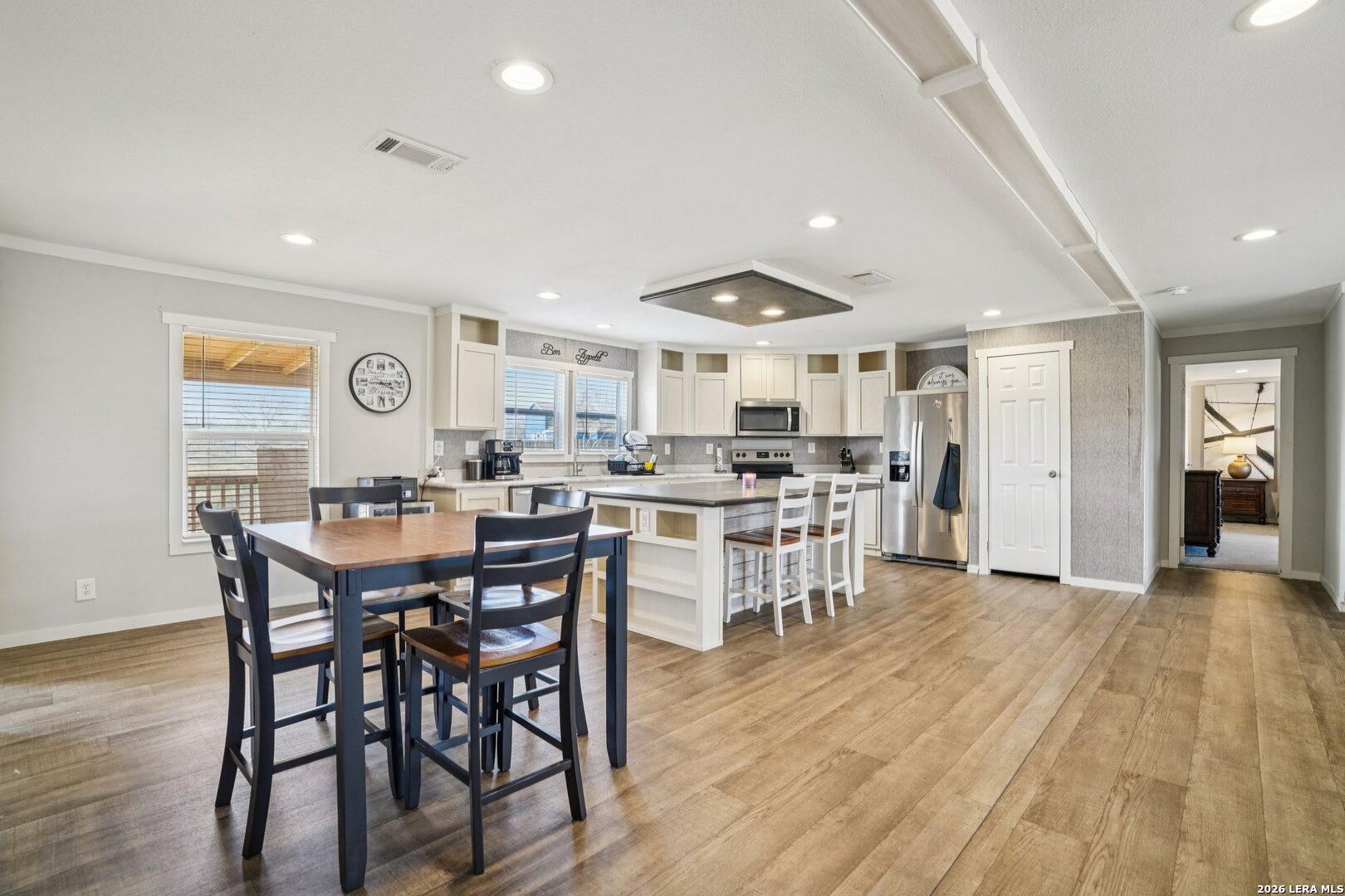 4045 Jakes Colony Road Seguin, TX 78155 - Photo 9 of 36 a view of a dining room with furniture and wooden floor