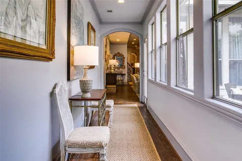 a view of a dining room with furniture and a window