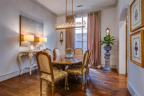 a view of a a dining room with furniture window and wooden floor