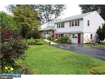 18 Red Lion Road Huntingdon Valley, PA 19006 - Photo 2 of 12 a front view of a house with a yard and trees