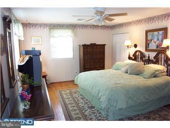 18 Red Lion Road Huntingdon Valley, PA 19006 - Photo 12 of 12 a bedroom with a bed and a dresser