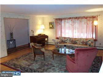 18 Red Lion Road Huntingdon Valley, PA 19006 - Photo 7 of 12 a living room with a couch and a table