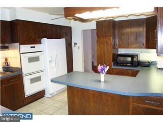18 Red Lion Road Huntingdon Valley, PA 19006 - Photo 9 of 12 a kitchen with stainless steel appliances a refrigerator and stove