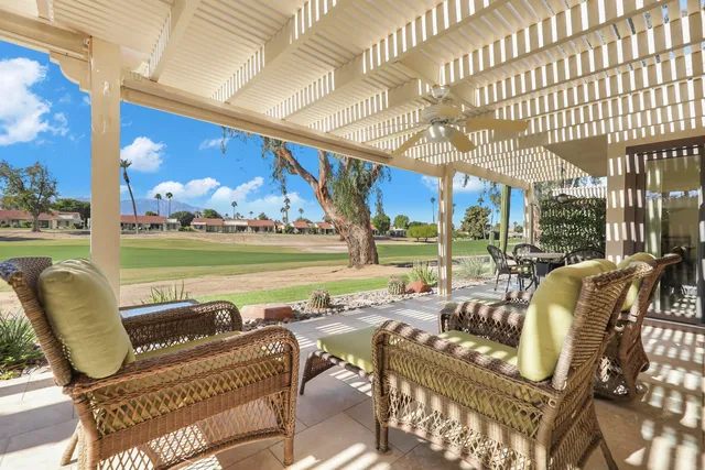 a view of swimming pool with outdoor seating and outdoor space