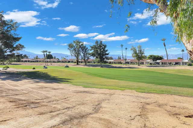 a view of a golf course with a house