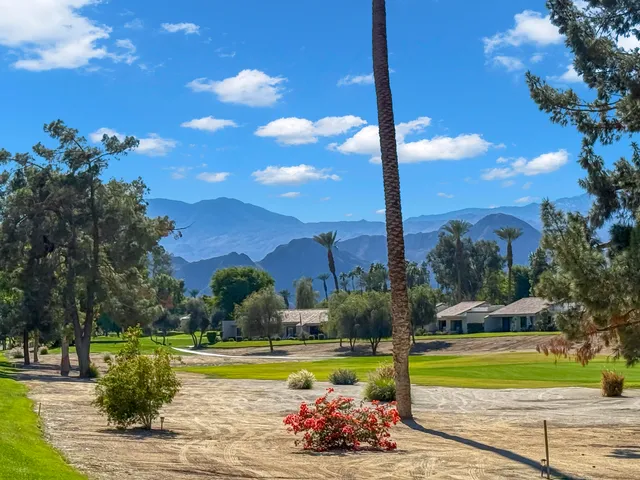 a view of a swimming pool with an outdoor space and seating area