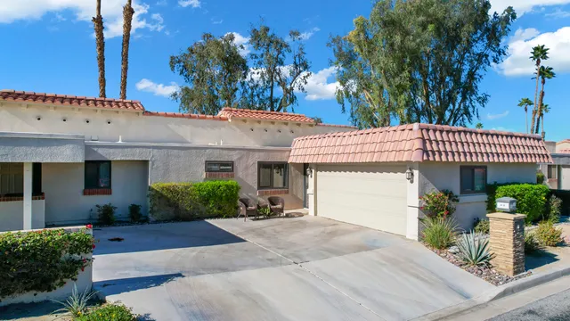 a front view of a house with a garage