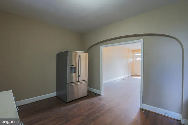 a bathroom with a tub shower sink and a toilet