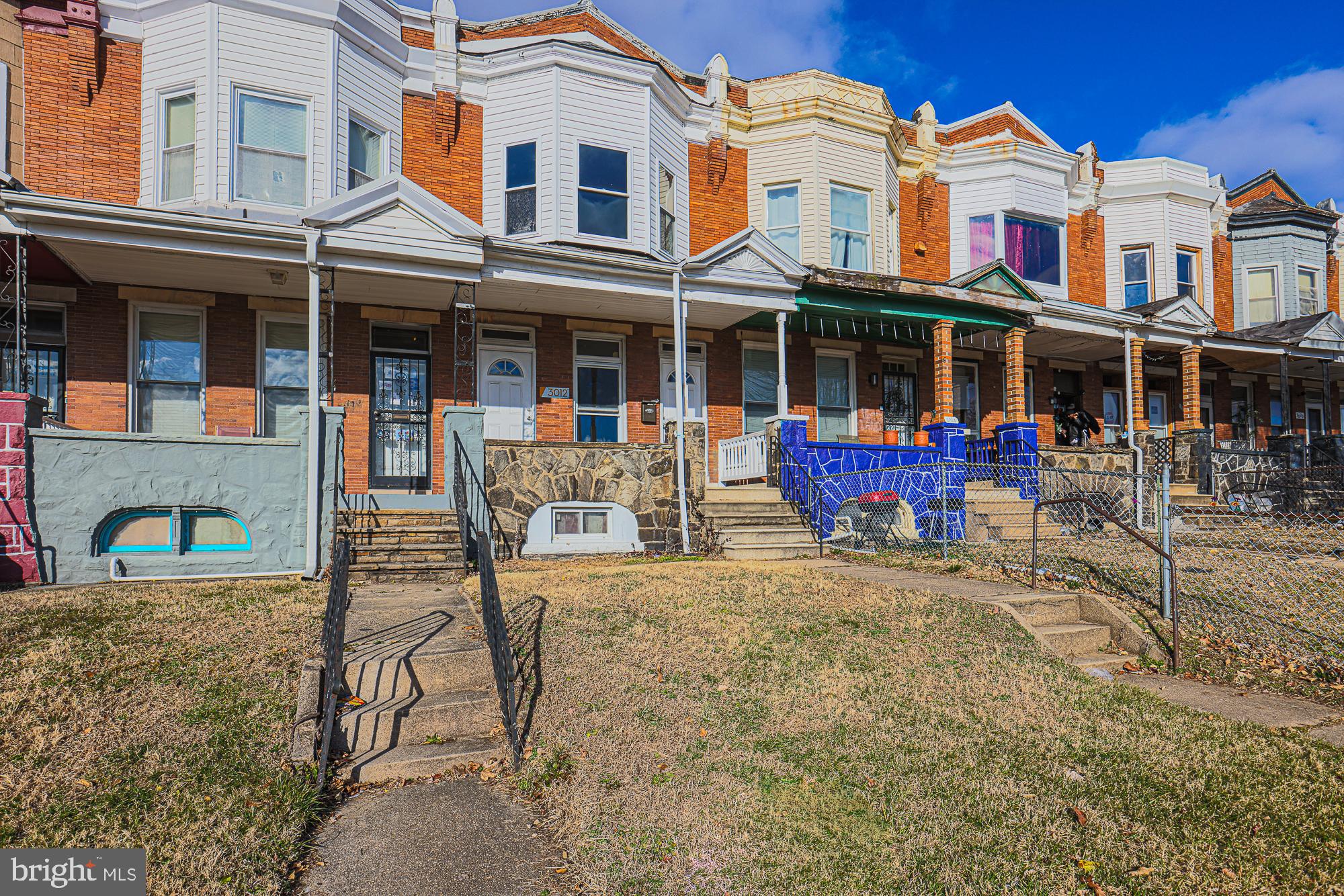 3012 Harford Road Baltimore, MD 21218 - Photo 2 of 42 front view of a building with a yard