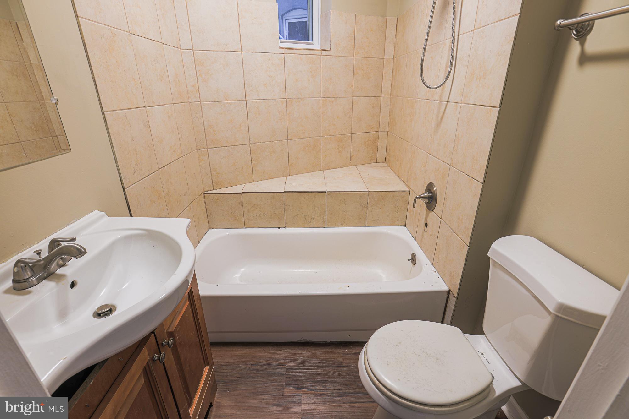 3012 Harford Road Baltimore, MD 21218 - Photo 21 of 42 a bathroom with a sink a toilet and a bathtub