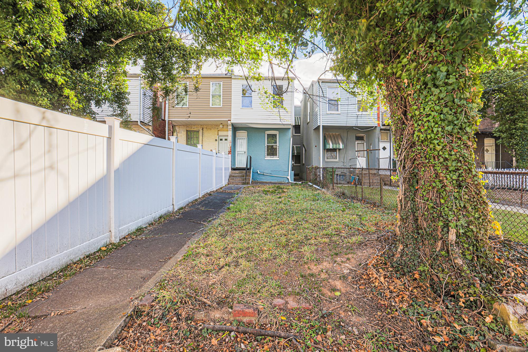 3012 Harford Road Baltimore, MD 21218 - Photo 28 of 42 a front view of a house with a yard