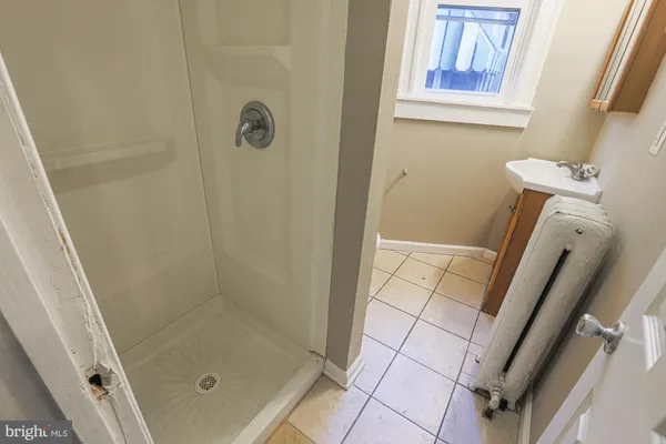 a white toilet sitting next to a bathroom sink