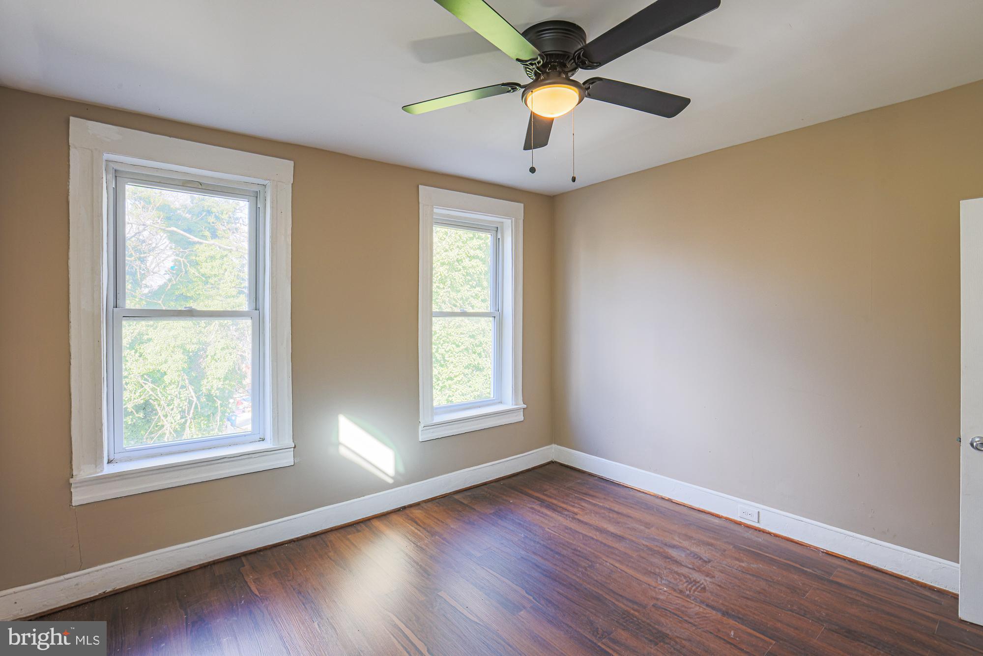 3012 Harford Road Baltimore, MD 21218 - Photo 42 of 42 a view of an empty room with wooden floor and a window