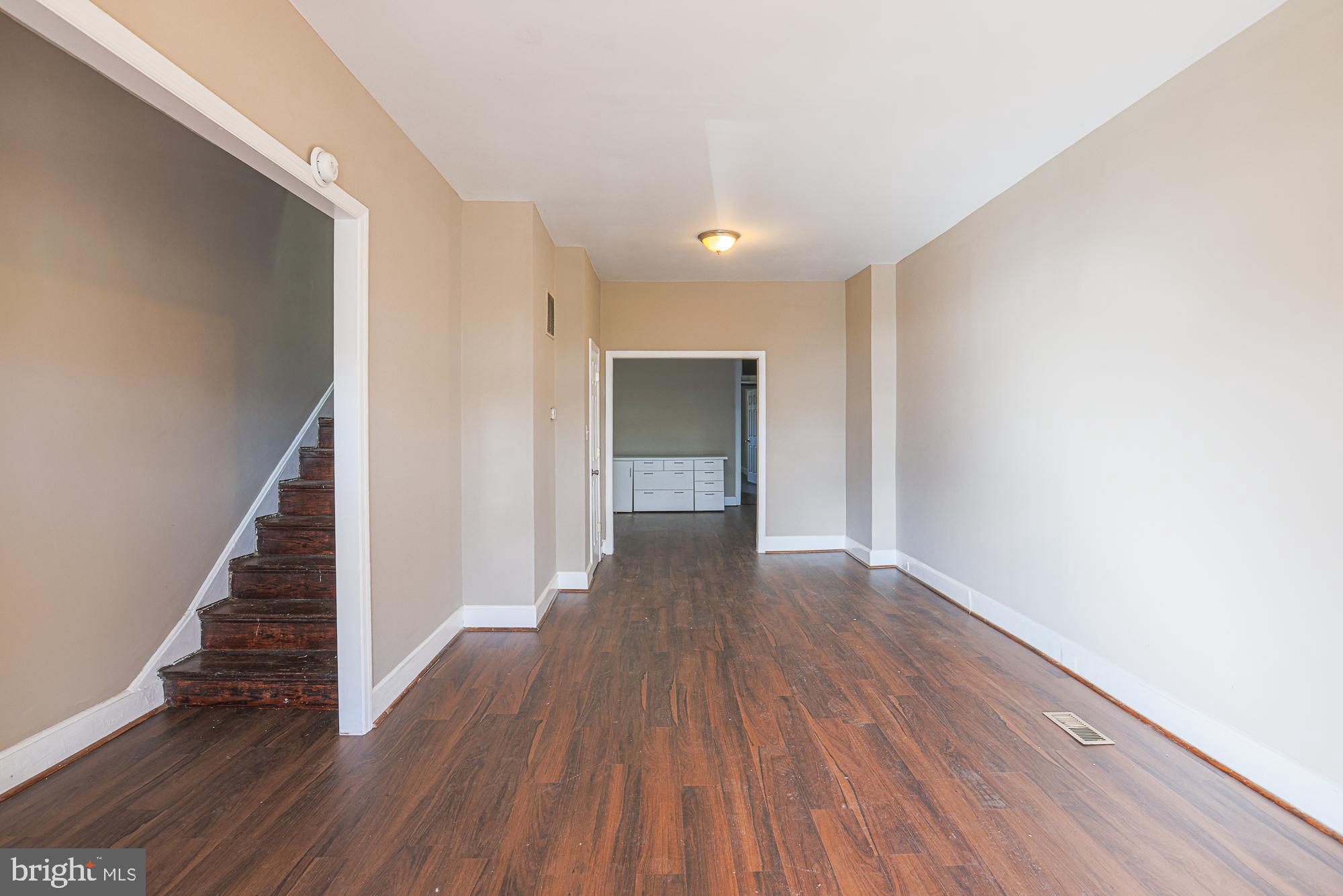 3012 Harford Road Baltimore, MD 21218 - Photo 9 of 42 a view of a hallway with wooden floor