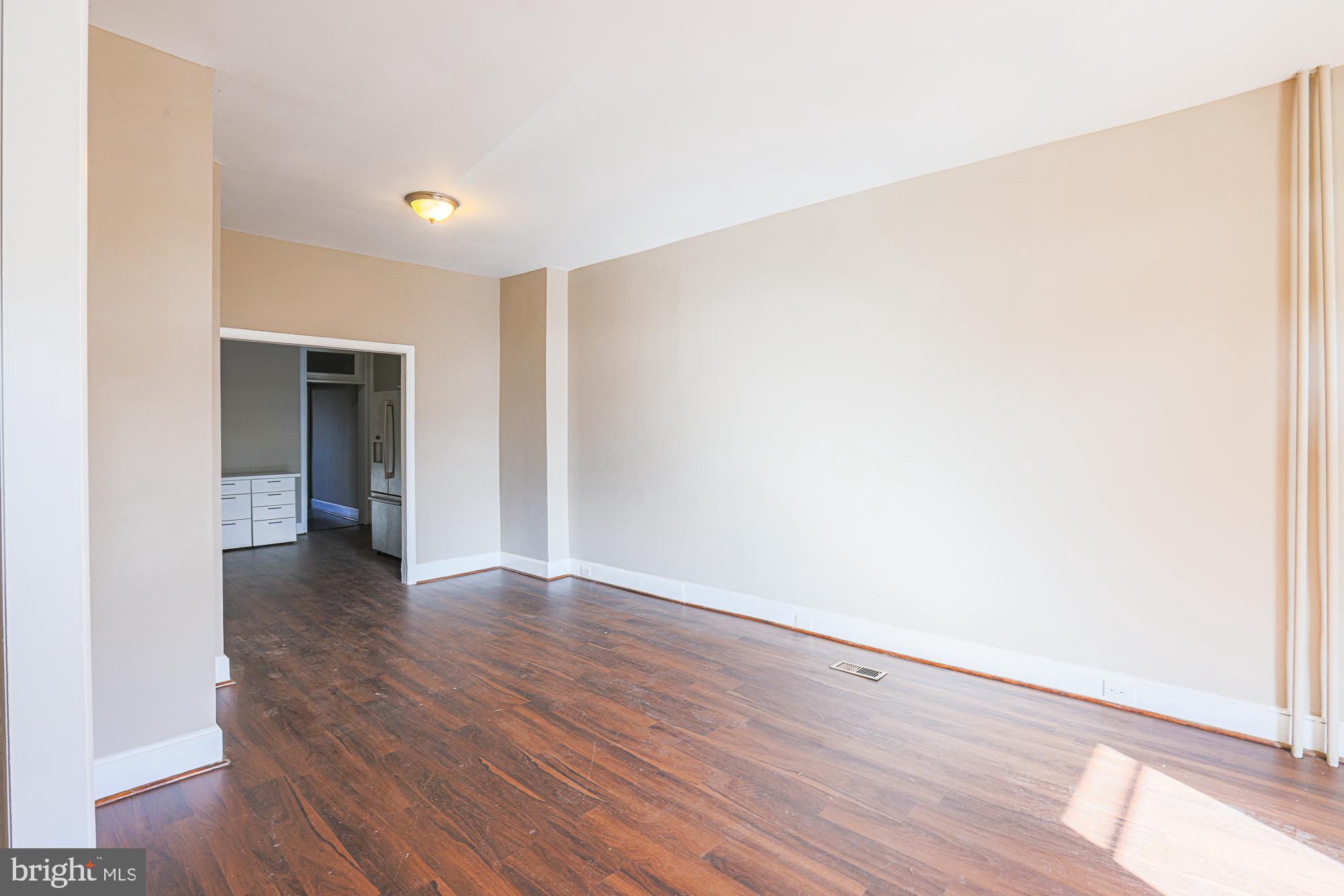 3012 Harford Road Baltimore, MD 21218 - Photo 10 of 42 a view of an empty room with wooden floor