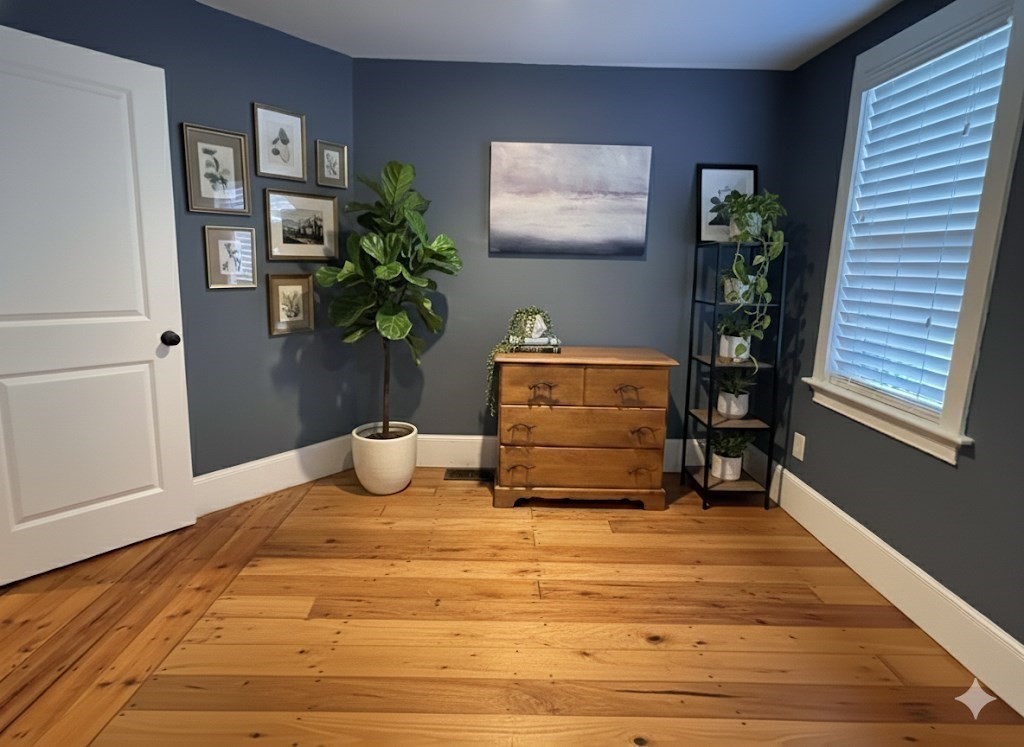 7 Hardy Street, Unit 1 Beverly, MA 01915 - Photo 16 of 24 a room with furniture and a potted plant