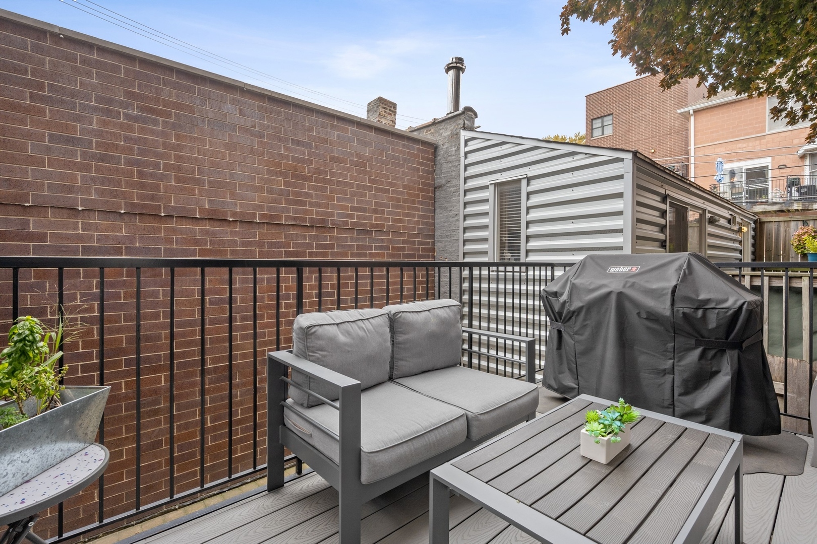 1341 West George Street, Unit 1 Chicago, IL 60657 - Photo 12 of 24 a blue bench sitting in front of a building