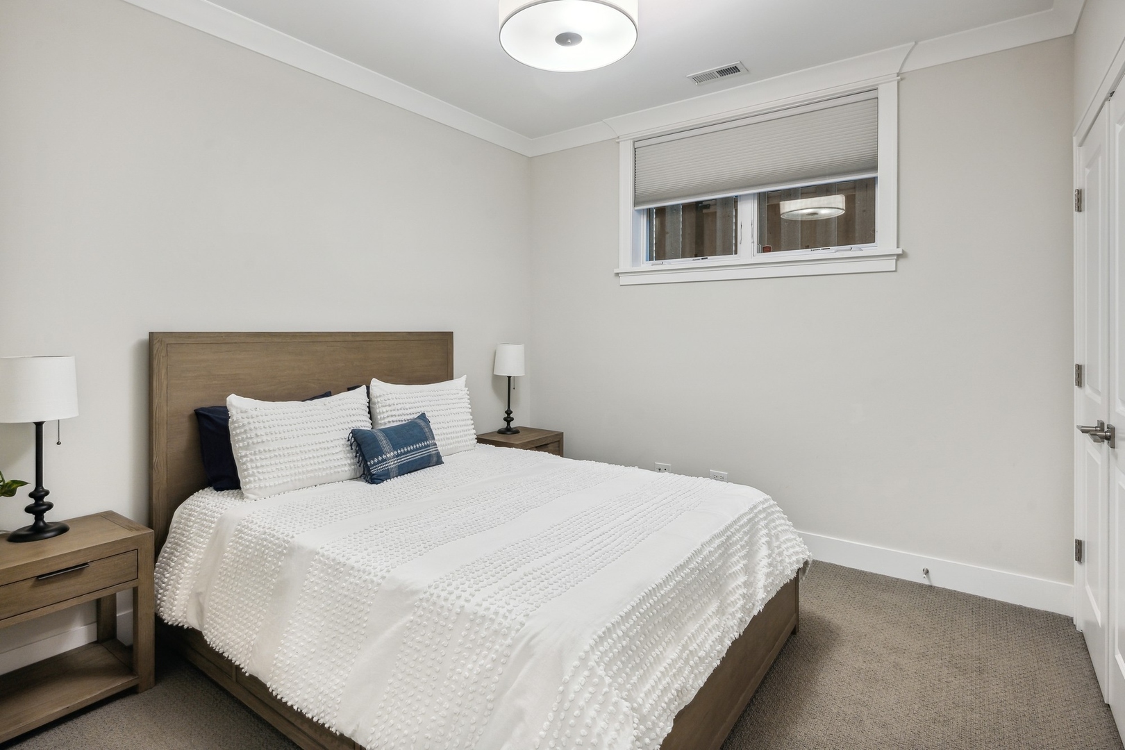 1341 West George Street, Unit 1 Chicago, IL 60657 - Photo 17 of 24 a bedroom with a bed and a night stand