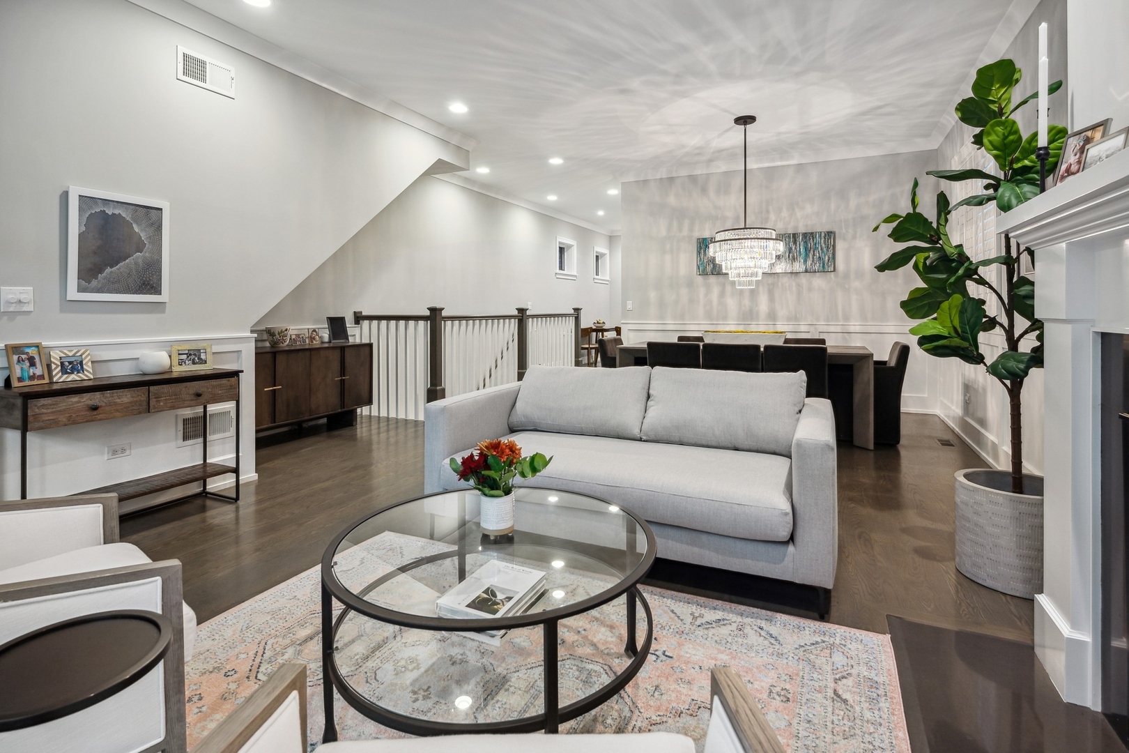 1341 West George Street, Unit 1 Chicago, IL 60657 - Photo 3 of 24 a living room with furniture and a chandelier