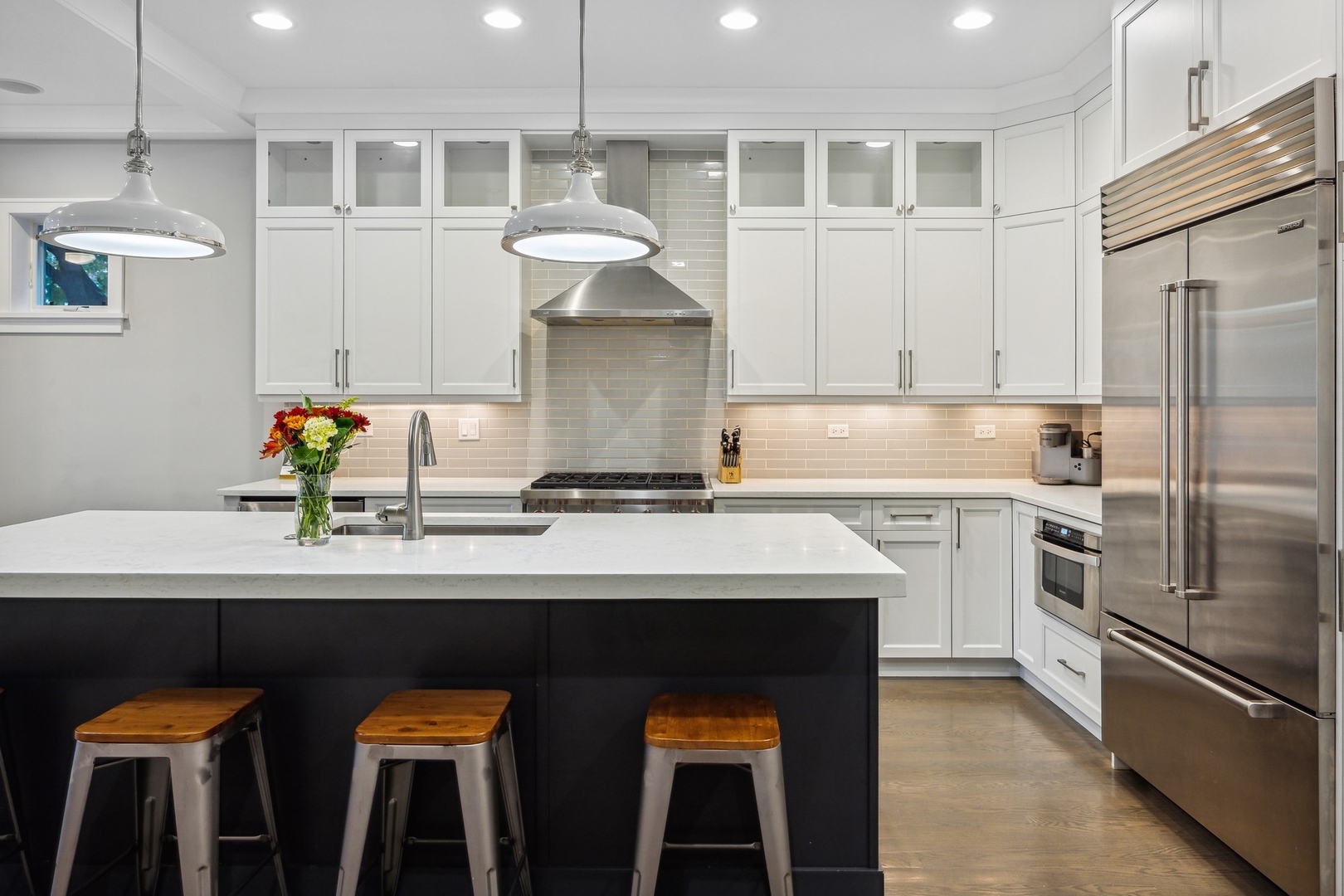 1341 West George Street, Unit 1 Chicago, IL 60657 - Photo 8 of 24 a kitchen with stainless steel appliances a sink stove and refrigerator