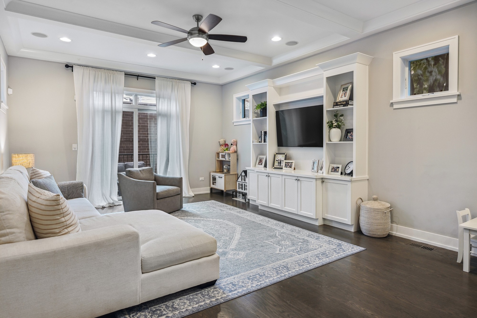 1341 West George Street, Unit 1 Chicago, IL 60657 - Photo 10 of 24 a living room with furniture and a flat screen tv