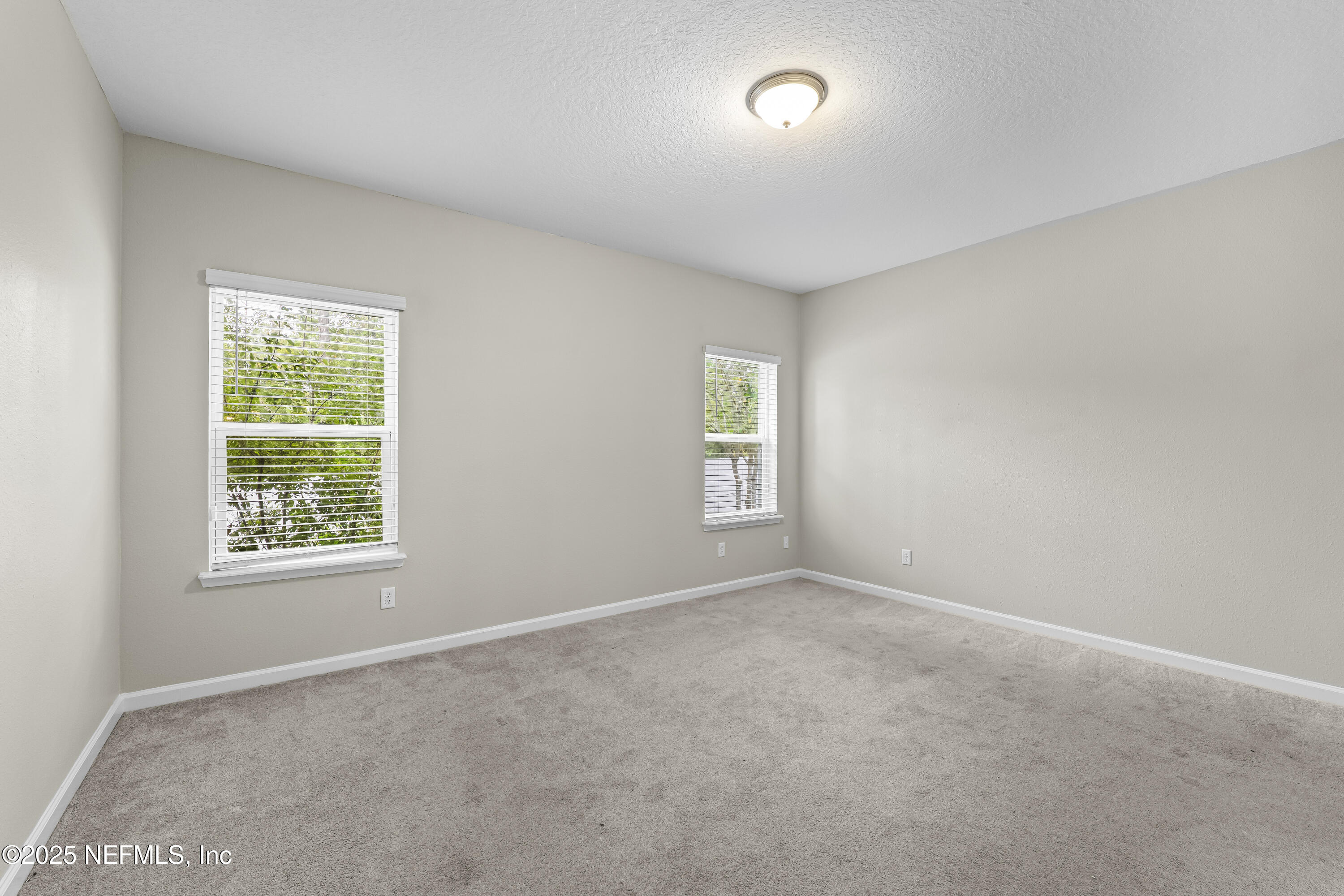 2113 Hawkeye Place Fleming Island, FL 32003 - Photo 14 of 30 an empty room with windows