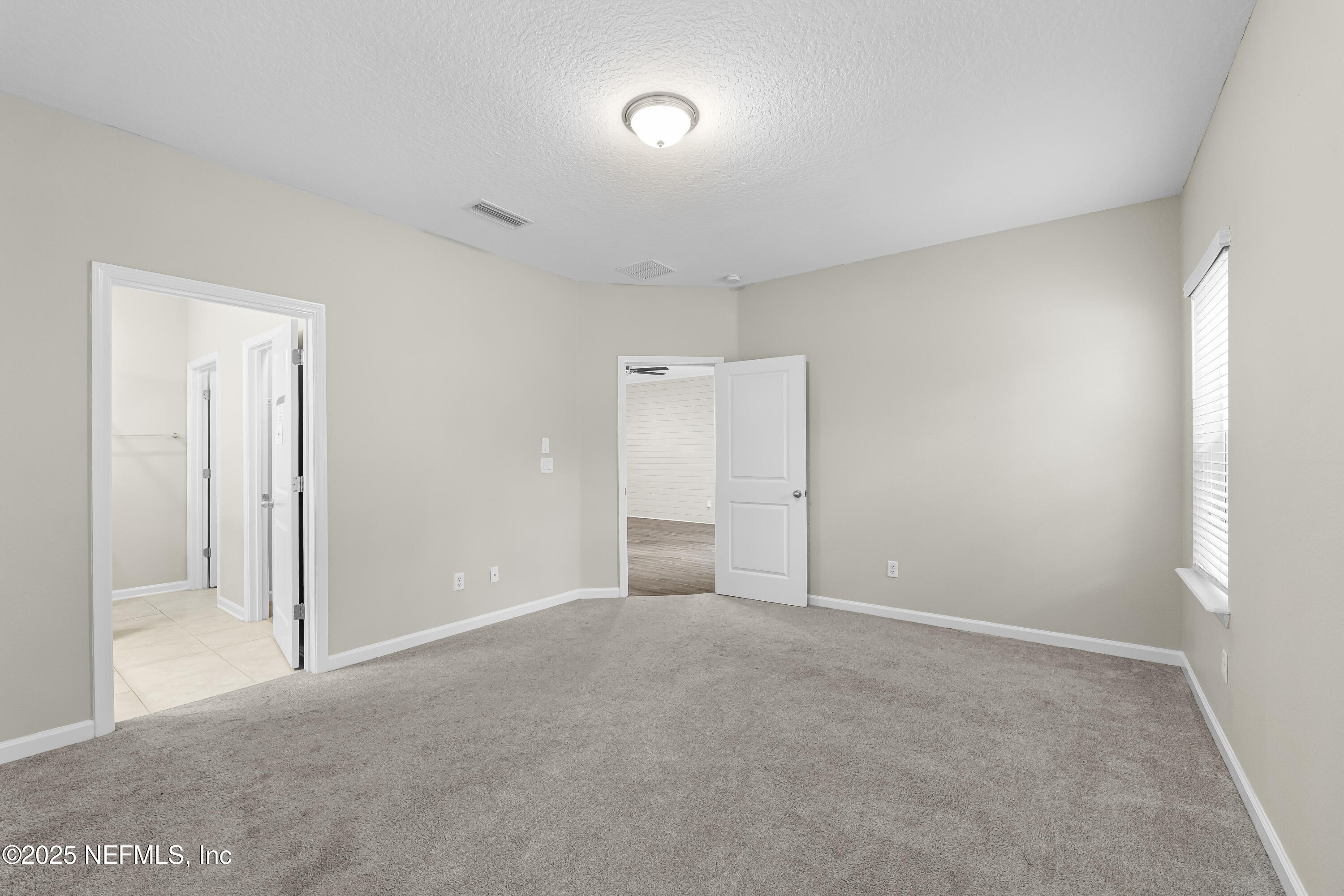 2113 Hawkeye Place Fleming Island, FL 32003 - Photo 15 of 30 a view of an empty room and a window