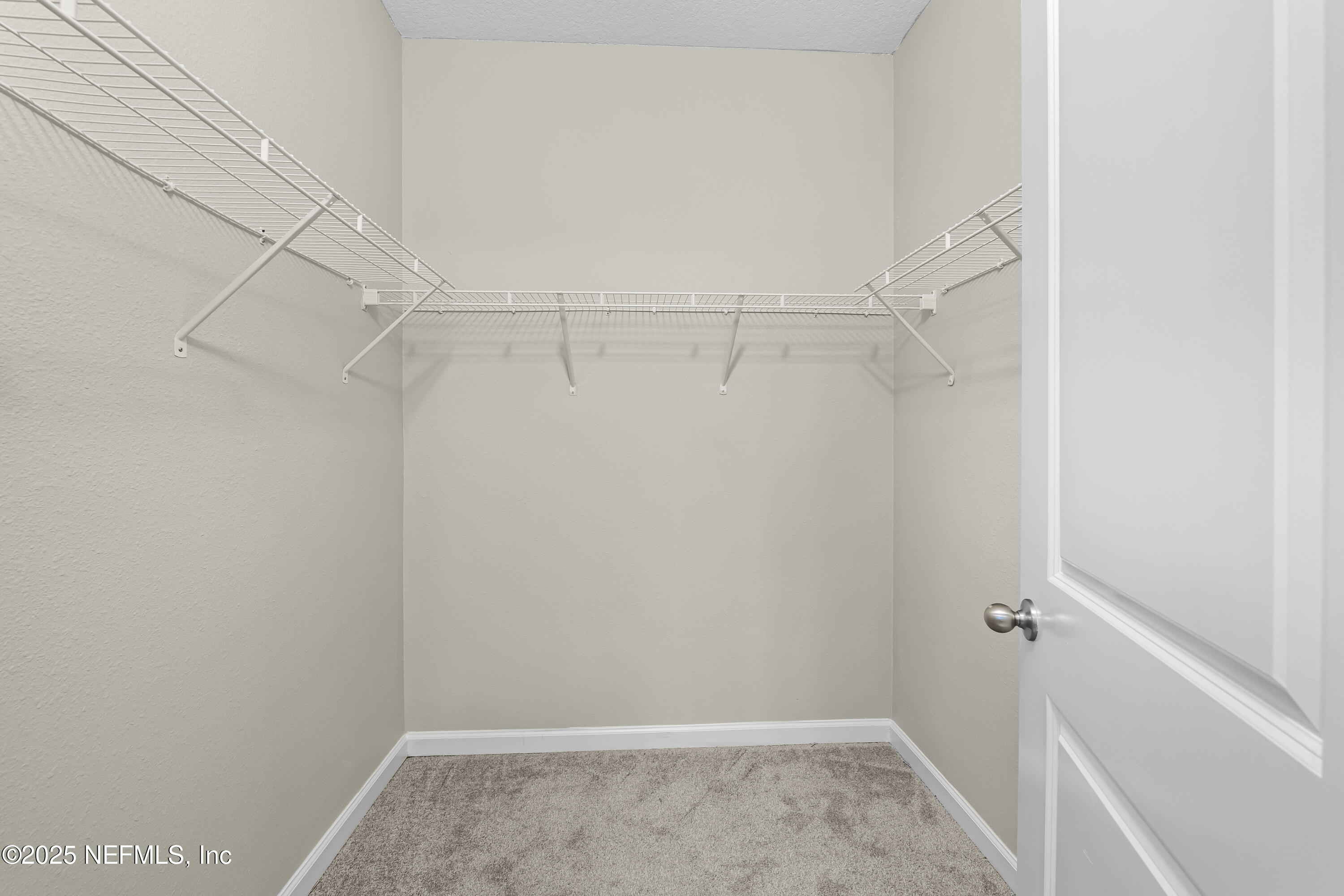 2113 Hawkeye Place Fleming Island, FL 32003 - Photo 17 of 30 a view of a room with racks on the wall