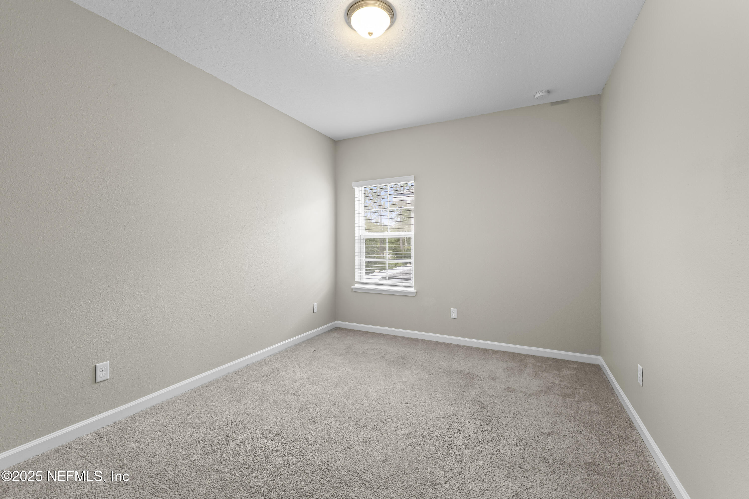 2113 Hawkeye Place Fleming Island, FL 32003 - Photo 21 of 30 a view of an empty room with a window