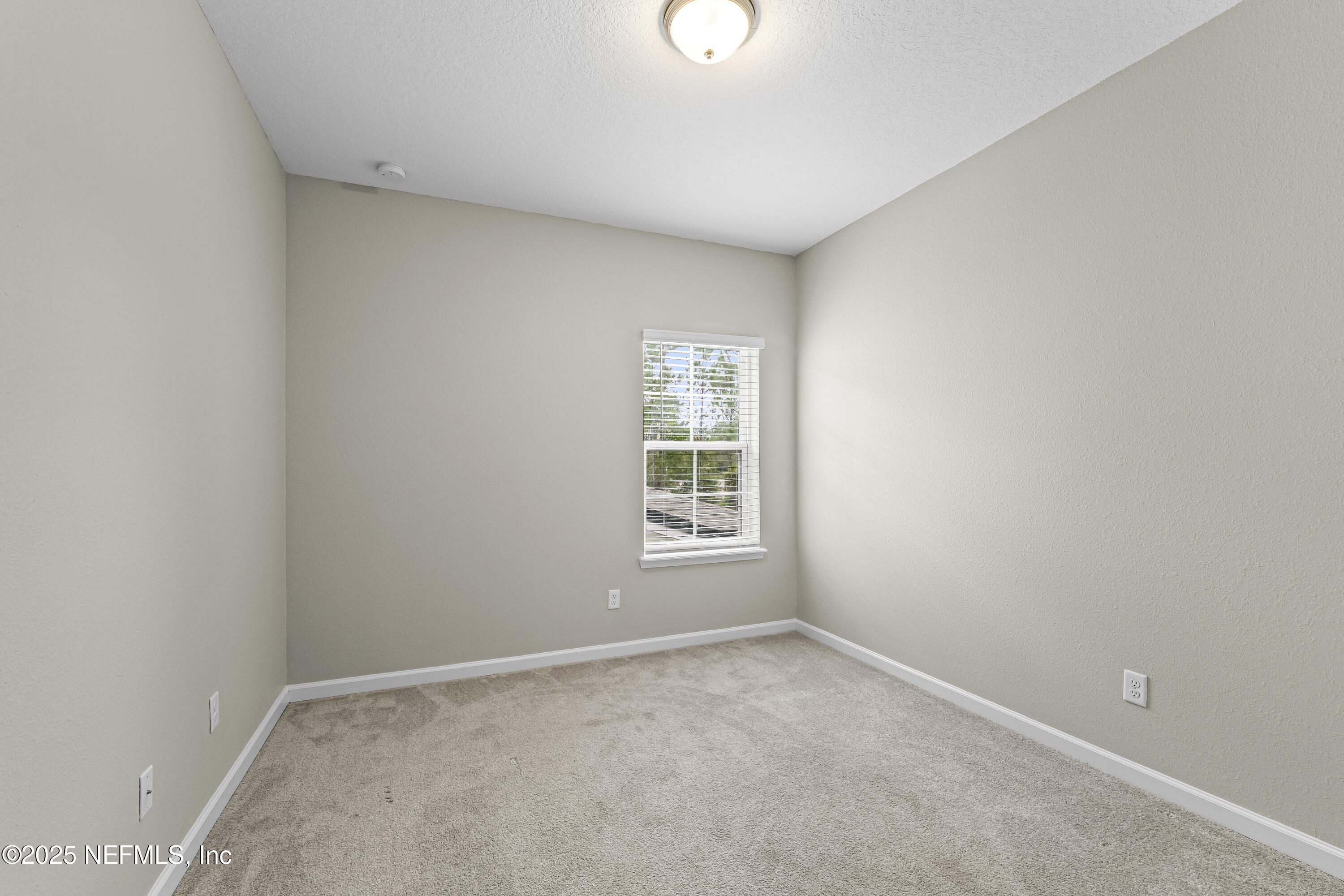 2113 Hawkeye Place Fleming Island, FL 32003 - Photo 22 of 30 a view of an empty room with a window