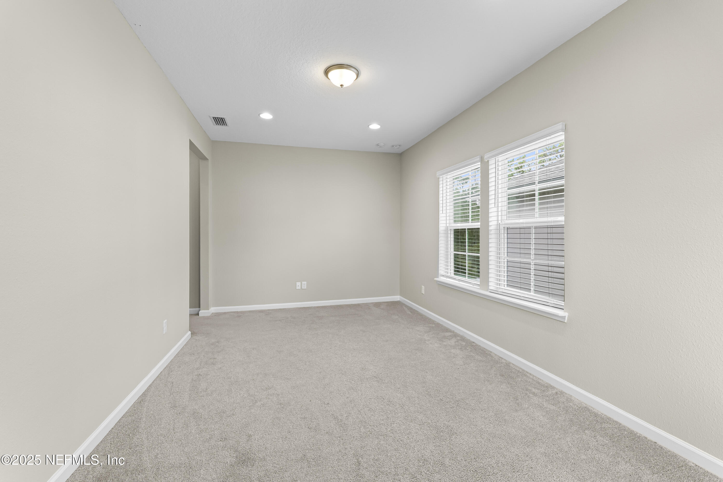 2113 Hawkeye Place Fleming Island, FL 32003 - Photo 23 of 30 a view of an empty room with a window