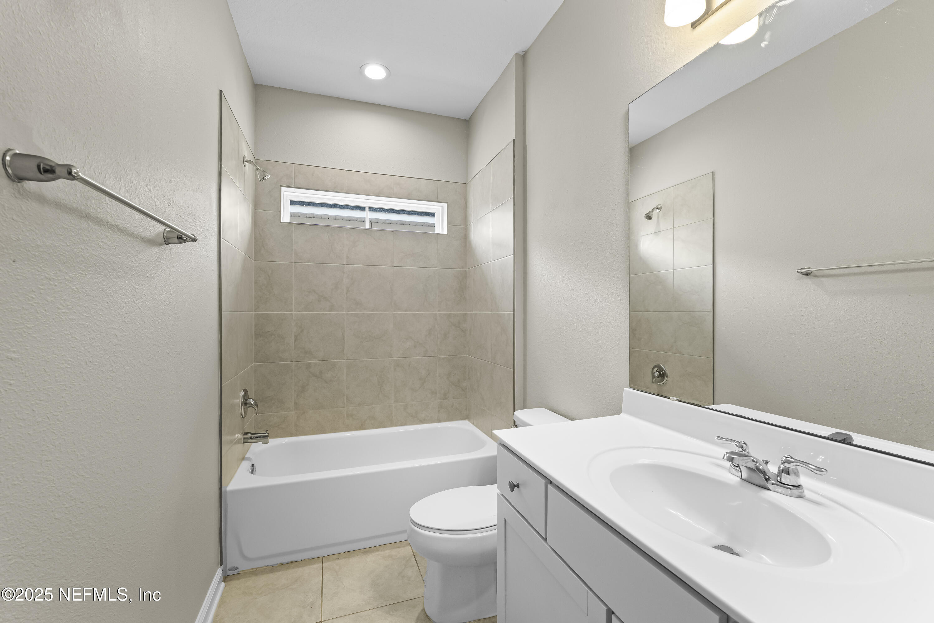 2113 Hawkeye Place Fleming Island, FL 32003 - Photo 24 of 30 a bathroom with a sink a toilet and shower
