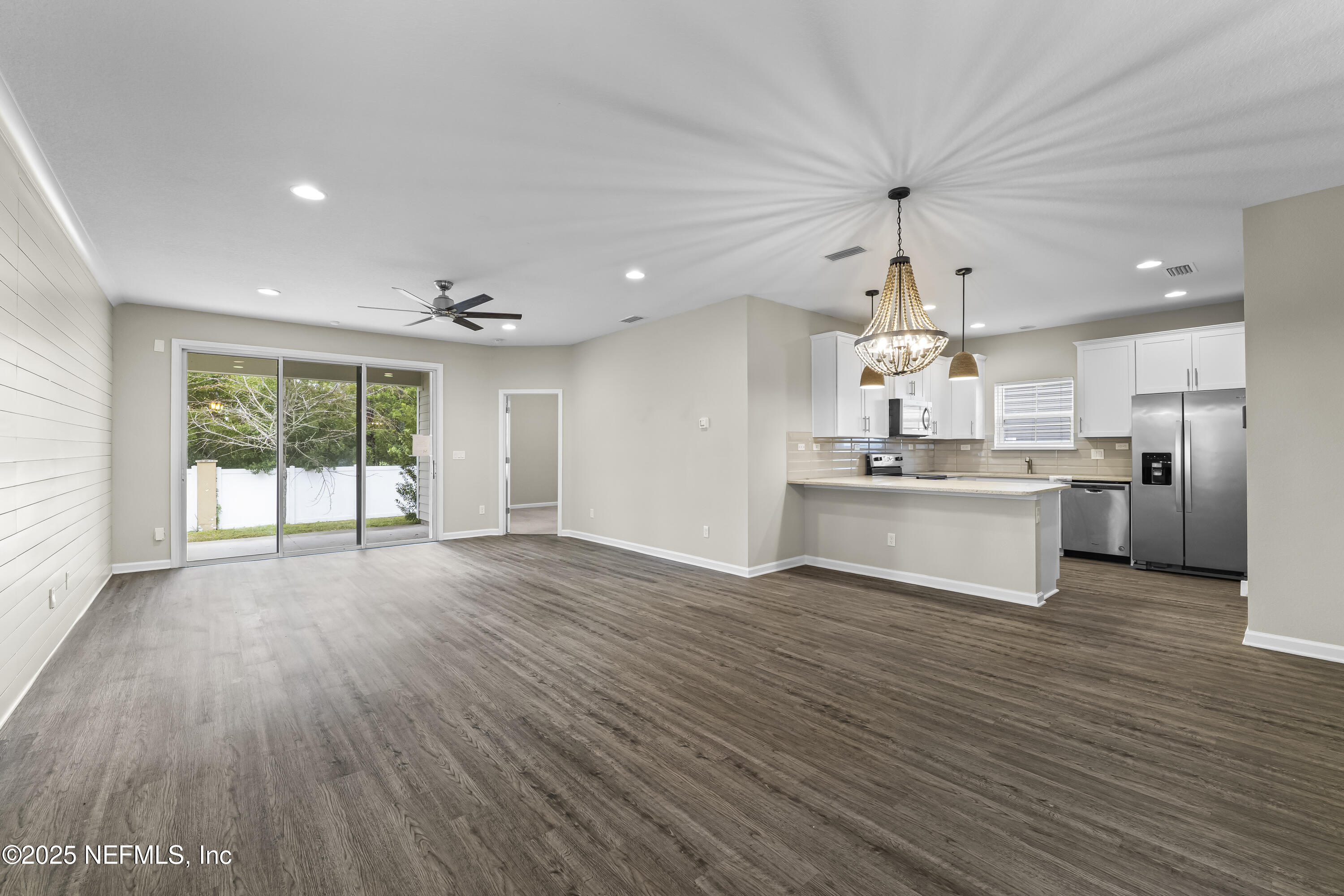 2113 Hawkeye Place Fleming Island, FL 32003 - Photo 4 of 30 a view of a kitchen with a sink and wooden floor