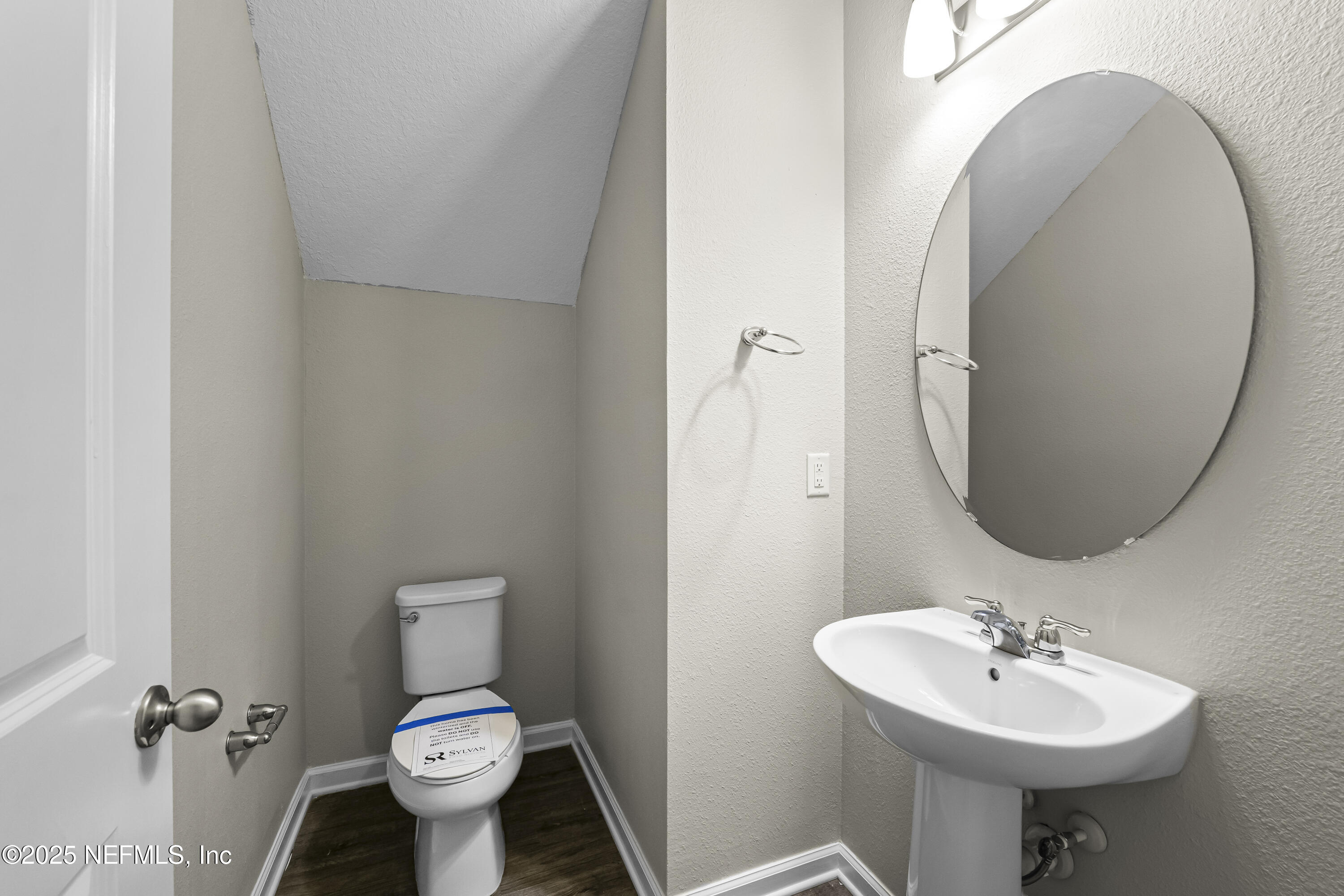 2113 Hawkeye Place Fleming Island, FL 32003 - Photo 8 of 30 a bathroom with a sink toilet and a mirror