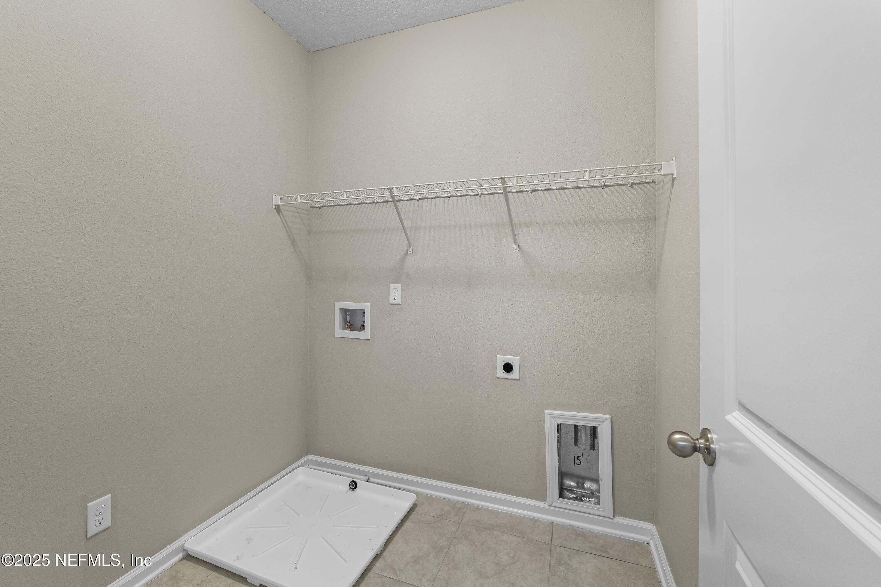 2113 Hawkeye Place Fleming Island, FL 32003 - Photo 9 of 30 a view of a room with racks on the wall